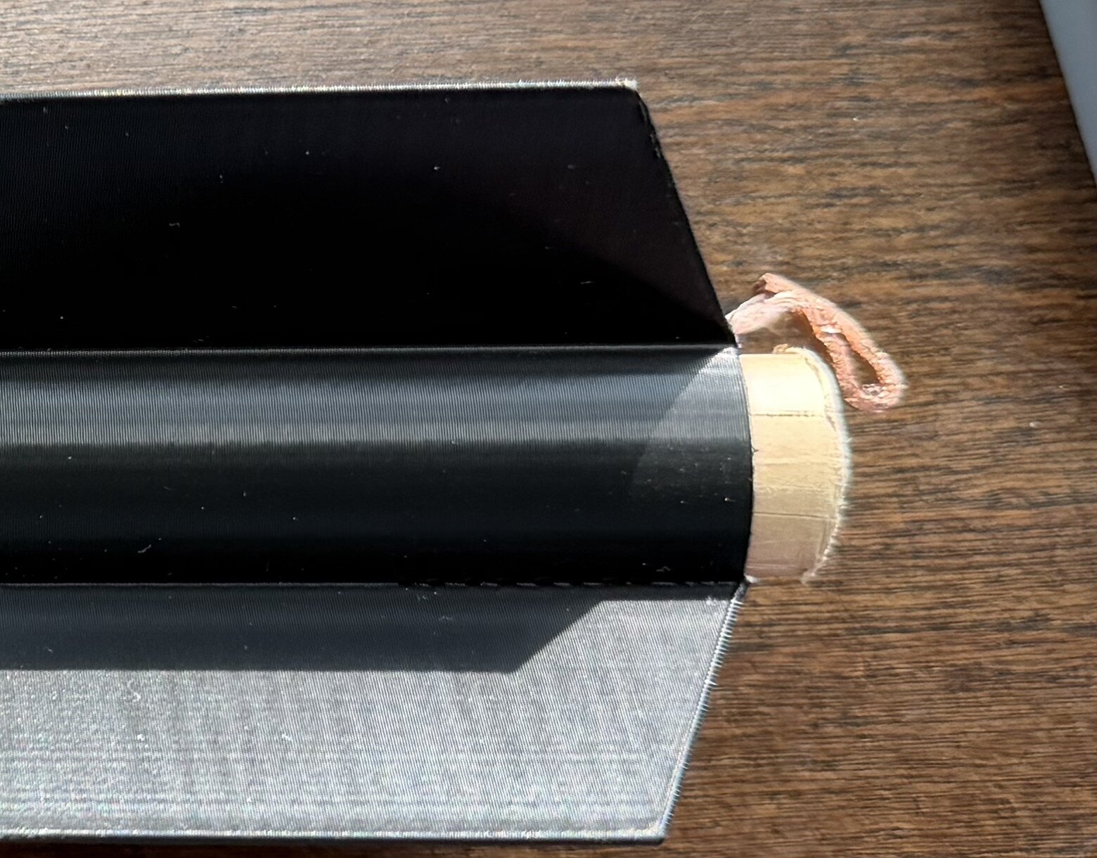 Aft end of the rocket showing the motor casing and copper retention clip